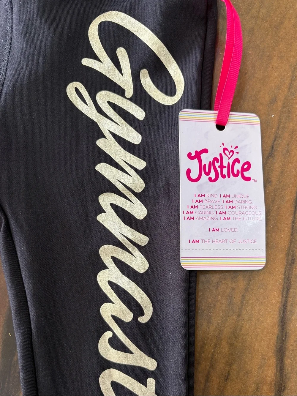 Justice Black Leggings with Pale Gold 'Gymnast' Script and Side Loop Detail